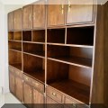 F42. Set of three Thomasville campaign style bookcases with cabinets. 77.5”h x 32”w x 20”d 
